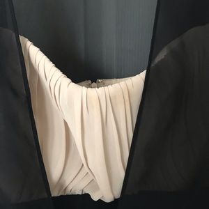 Nude and black cocktail dress.